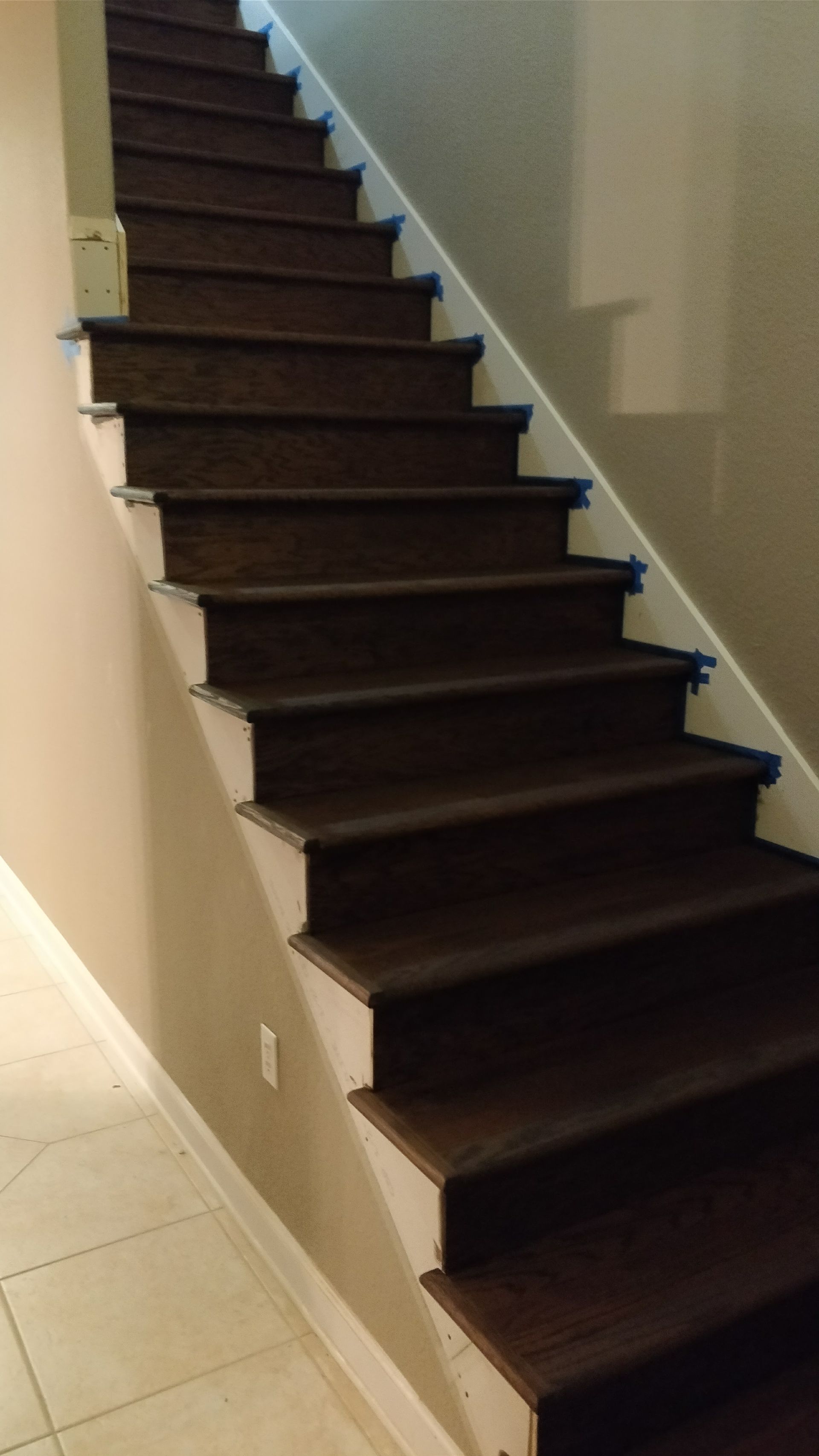 A close up of a wooden staircase in a house