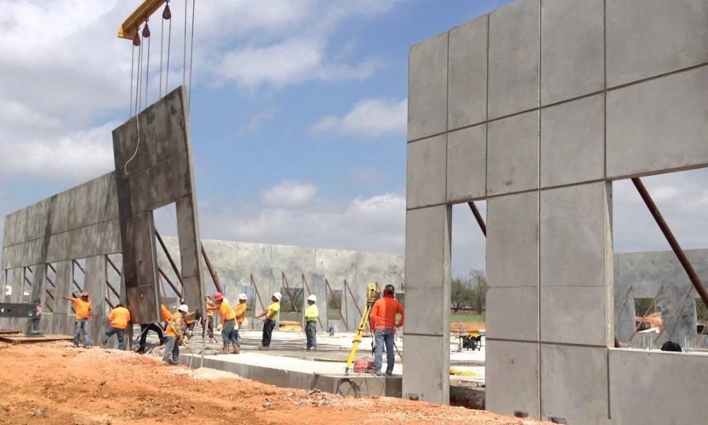 A group of construction workers are working on a building
