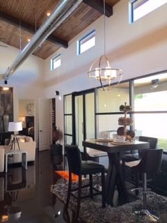 A living room with a table and chairs in it