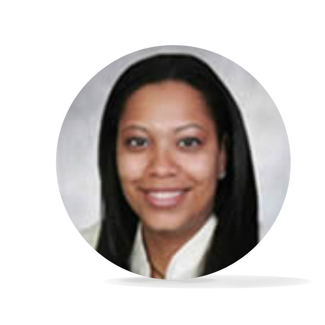 Woman with long, dark hair smiles; wears a white collared shirt.