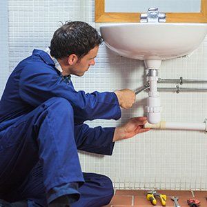 Plumber fixing sink - Plumbing Service & Repair in Mckinney, TX