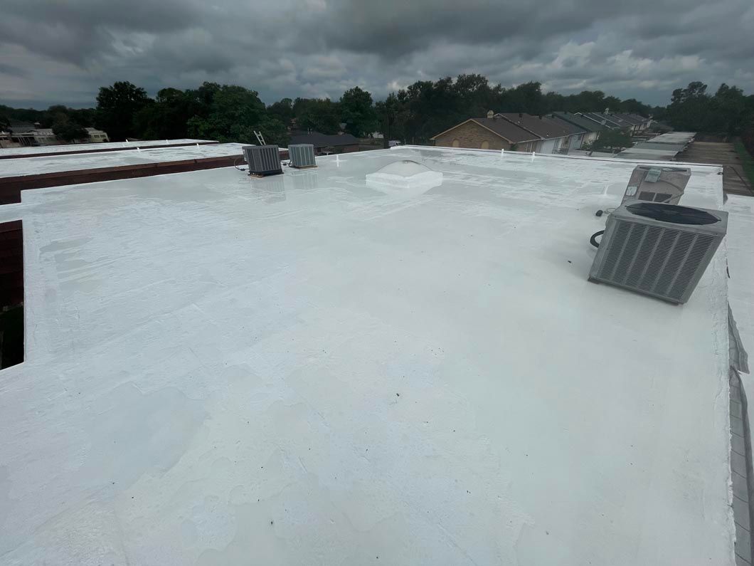 A white roof with a air conditioner on top of it.