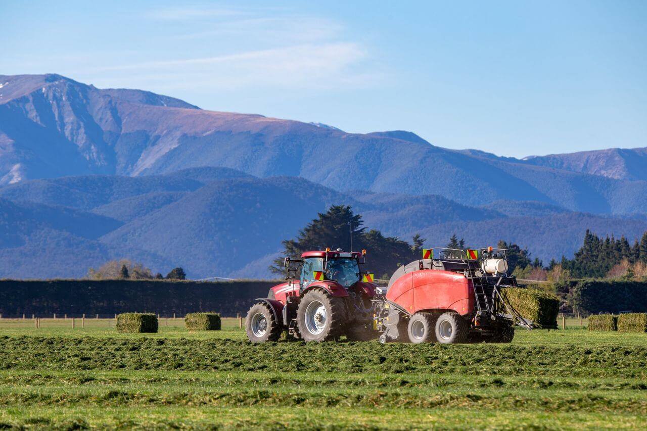 Red tractor in a field - Brown Glassford and Co - Farming Accountants Christchurch