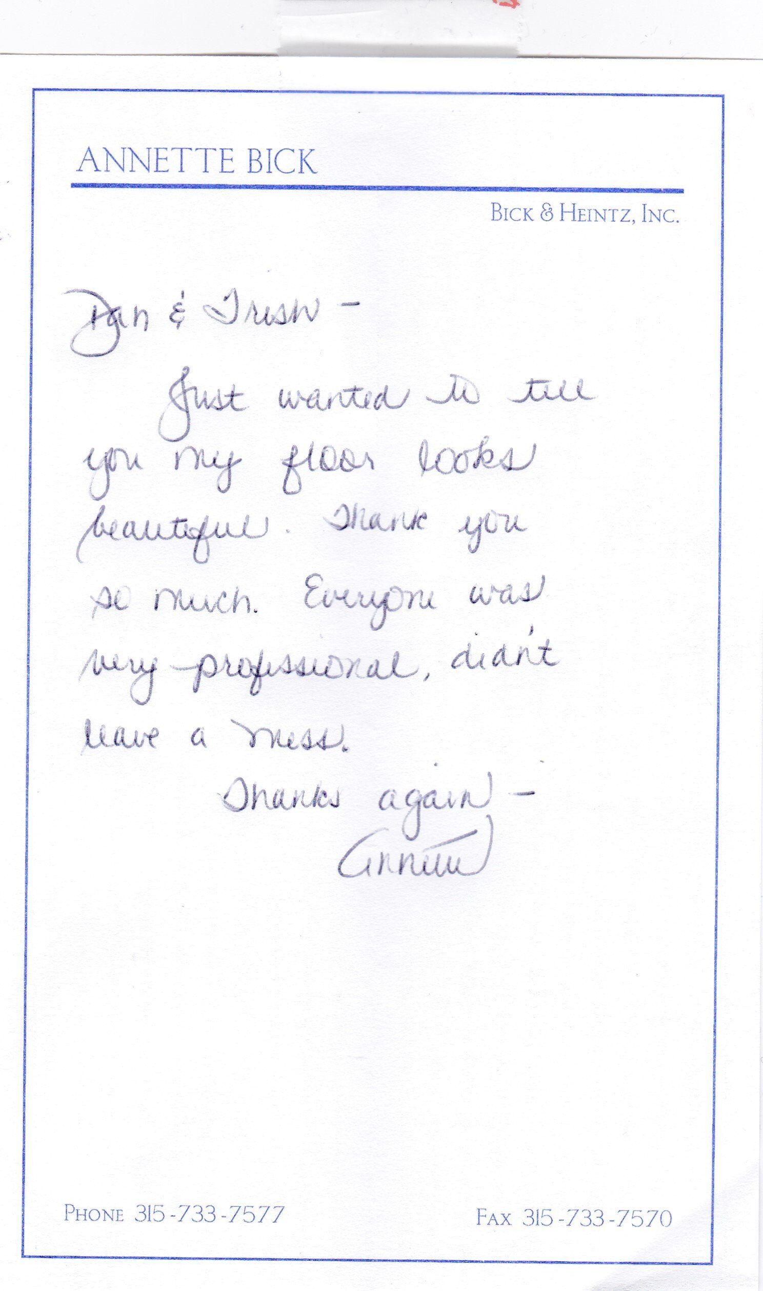 A letter is written in a foreign language on a piece of paper.