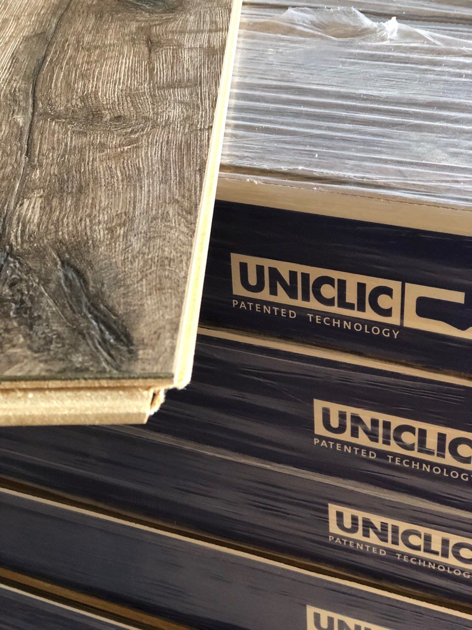 A stack of boxes with the word uniclick on them