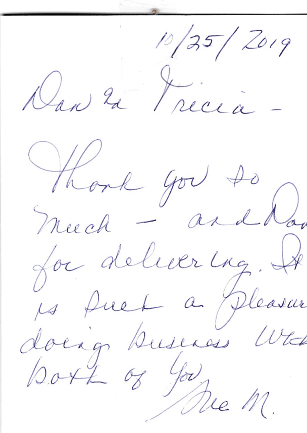 A handwritten thank you note from dan and tricia