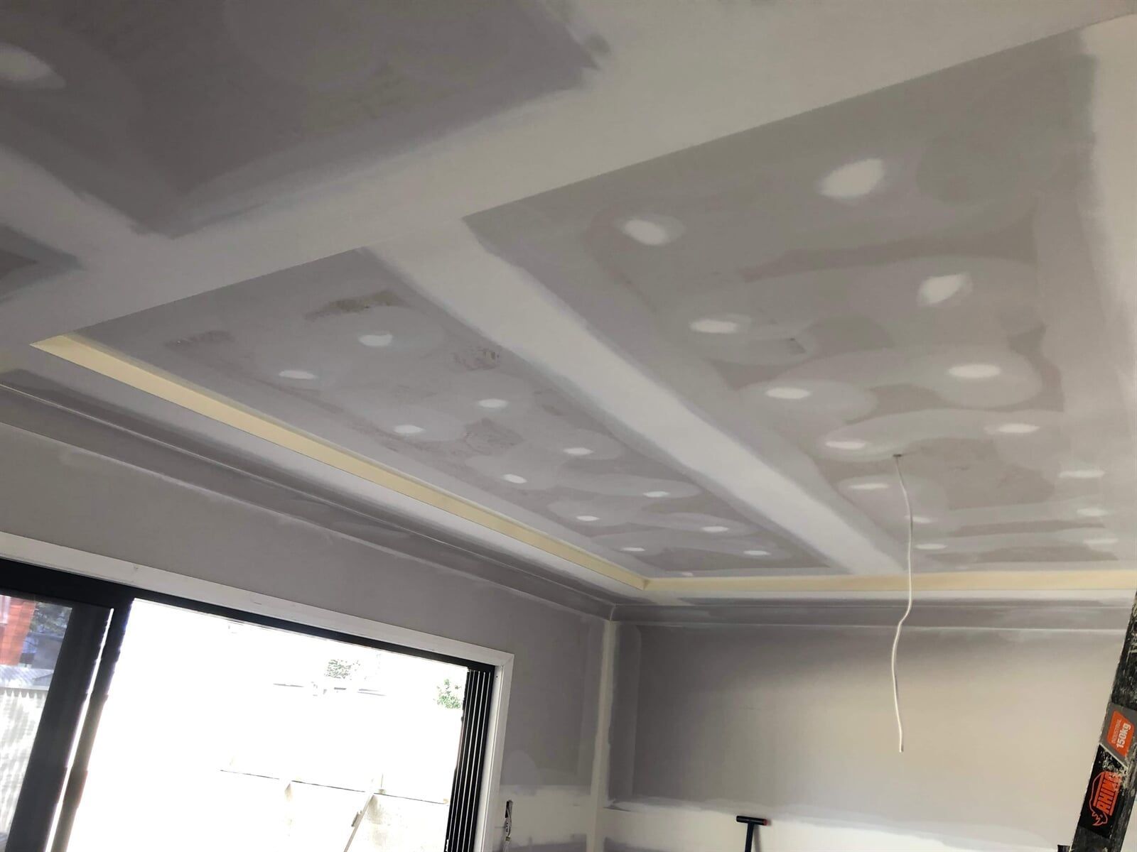 A Room With a Ceiling That is Being Remodeled and a Window — Plaster Installation in Bensville, NSW
