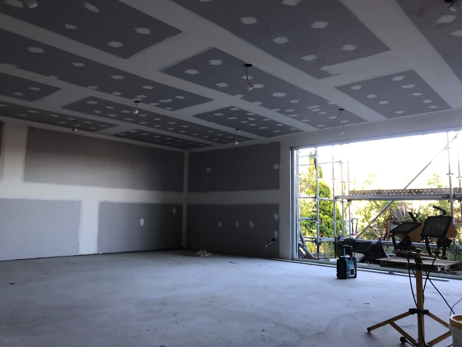 An Empty Room With a Ceiling That Has Holes in It — Plaster Installation in Bensville, NSW
