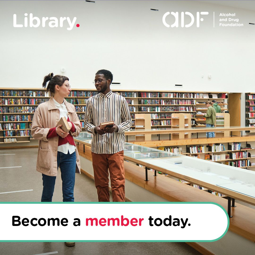 Two people talk while holding books in a library, overlaid with text: 