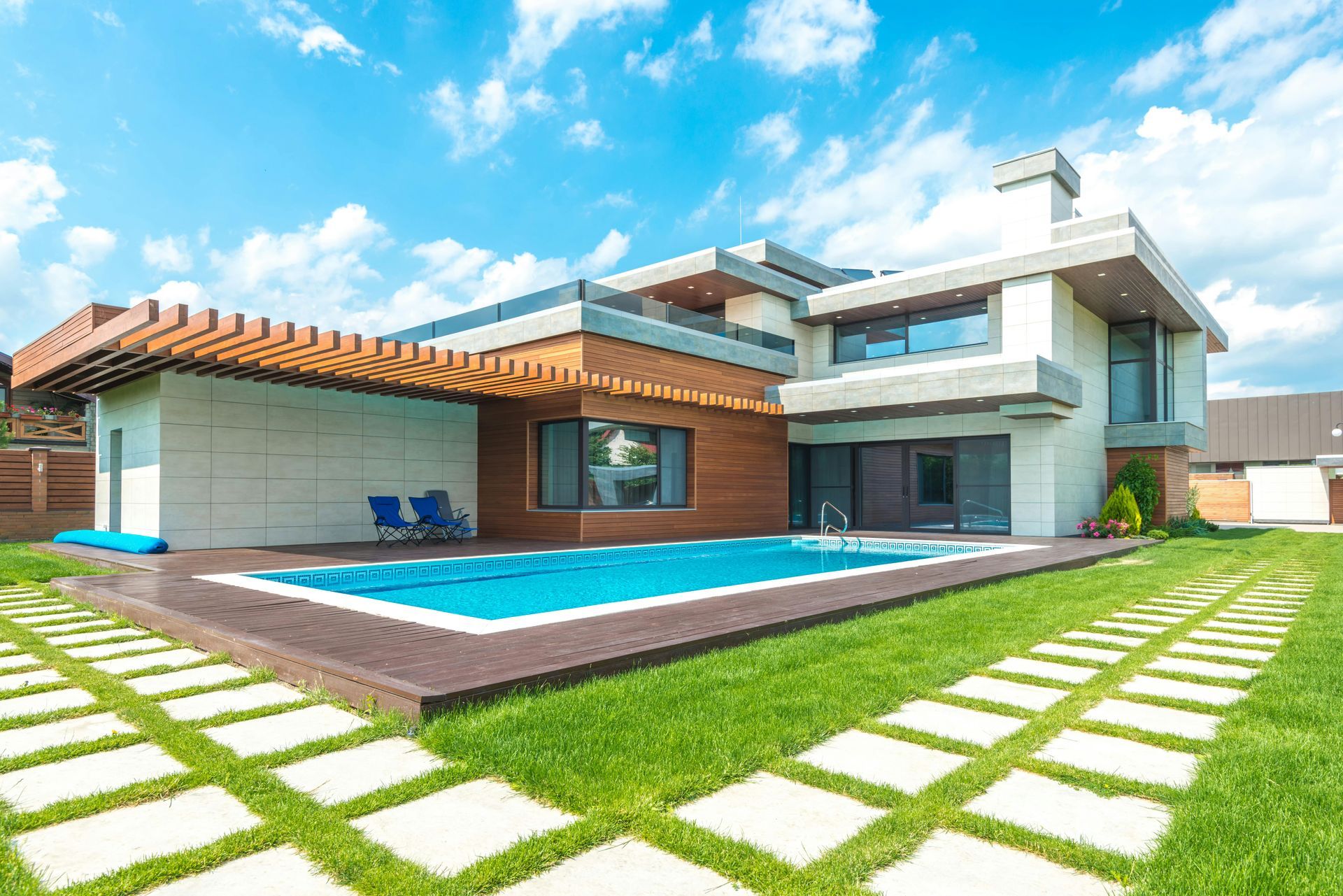 A large house with a swimming pool in the backyard.