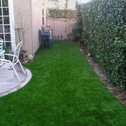 white chairs and fake grass
