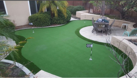 synthetic putting green with patio chairs