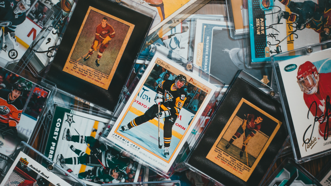 Hockey trading cards in protective cases, various colors and action poses.
