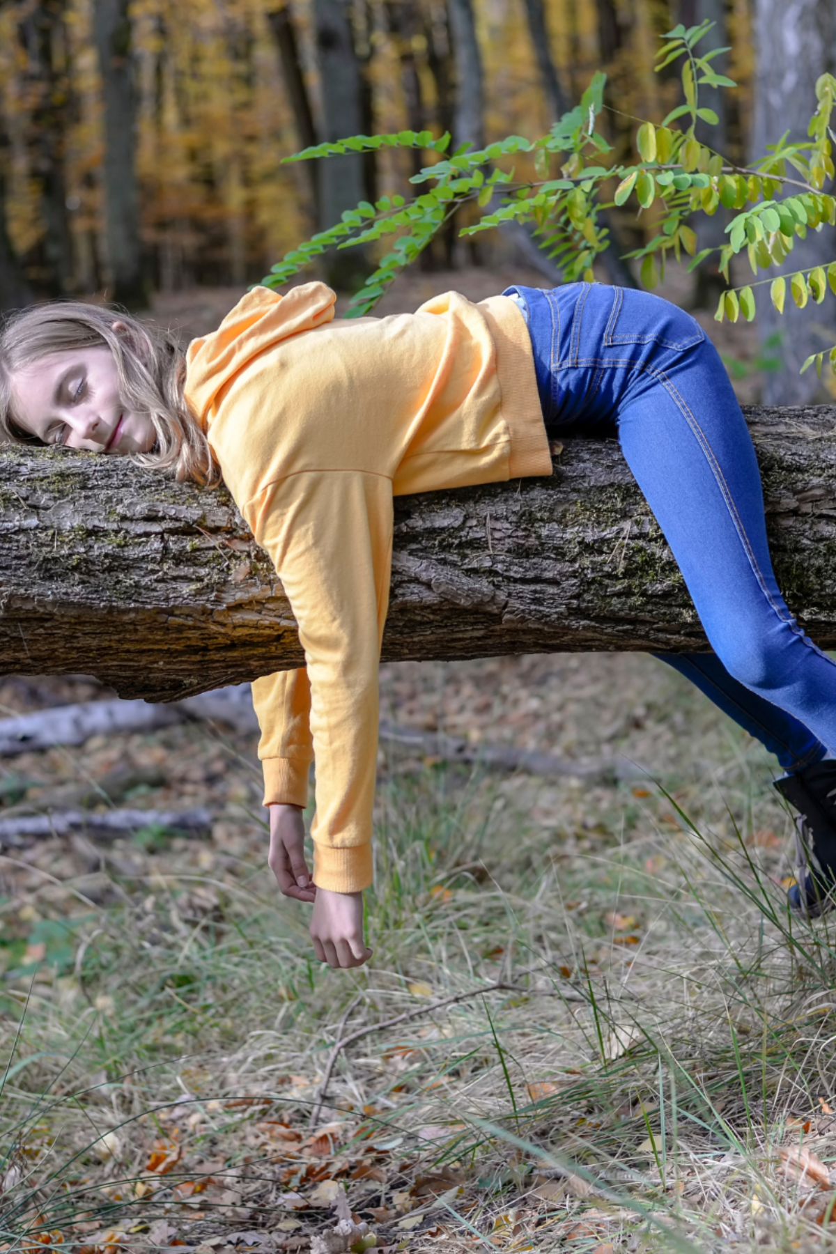 girl sleeping on branch