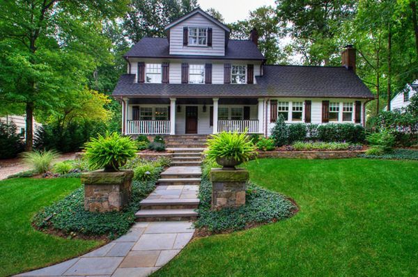 A large house with a stone walkway leading to it