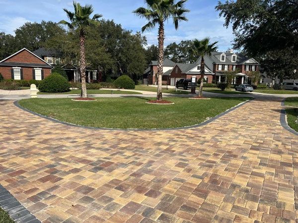 red and brown paver community driveway and walkways