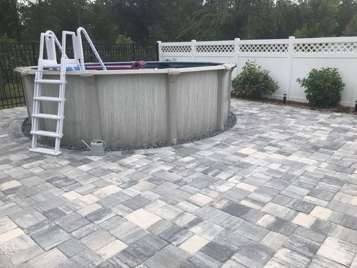 mixed grey concrete paver pool deck