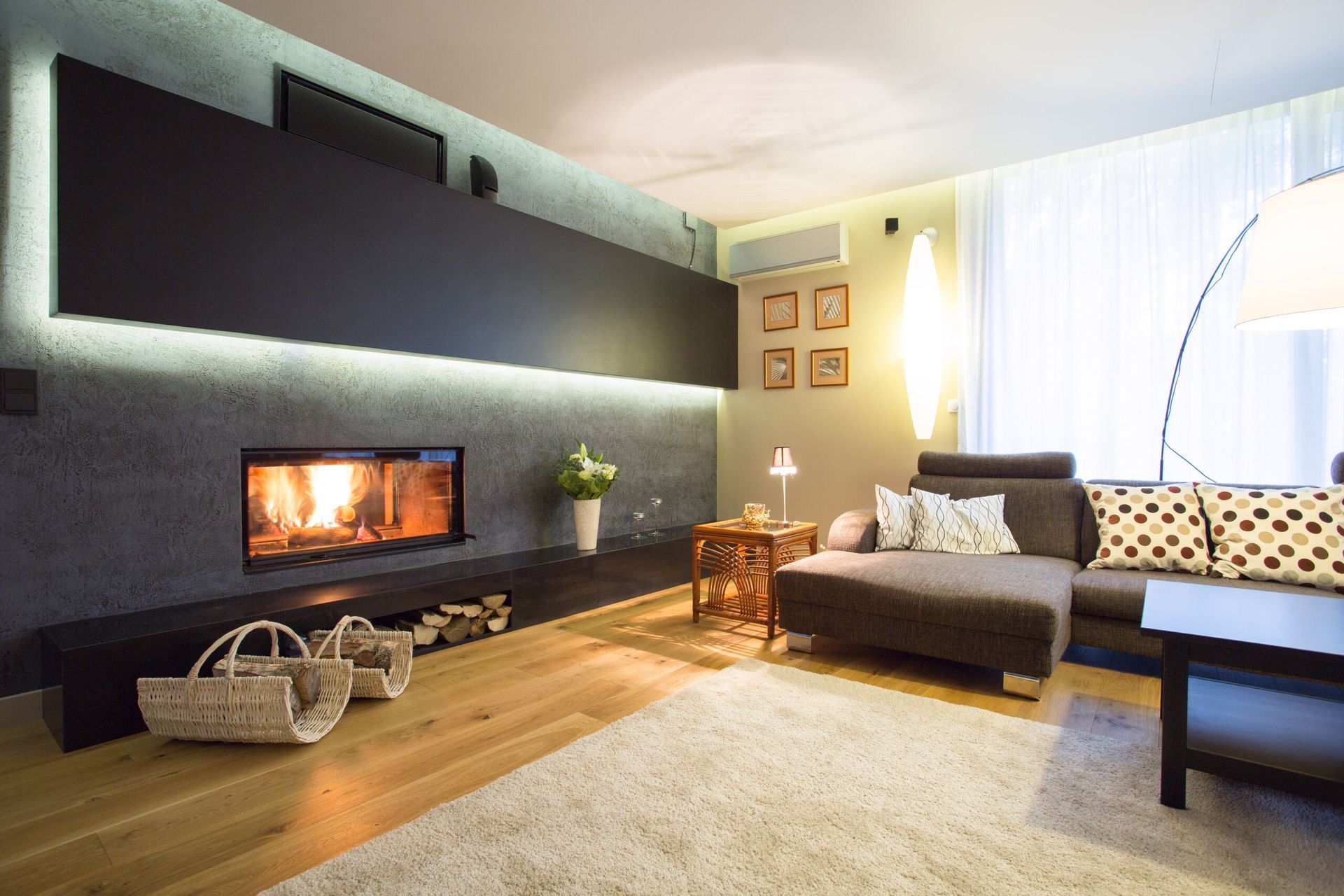 A Living Room With A Fireplace And A Couch — PalmAir Heating & Cooling Specialists In Tumut, NSW