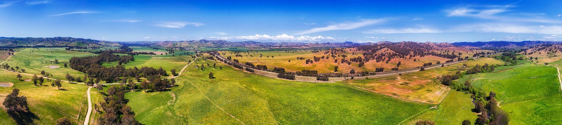 An Aerial View Of A Lush Green Field With Trees In The Background — PalmAir Heating & Cooling Specialists In Gundagai, NSW
