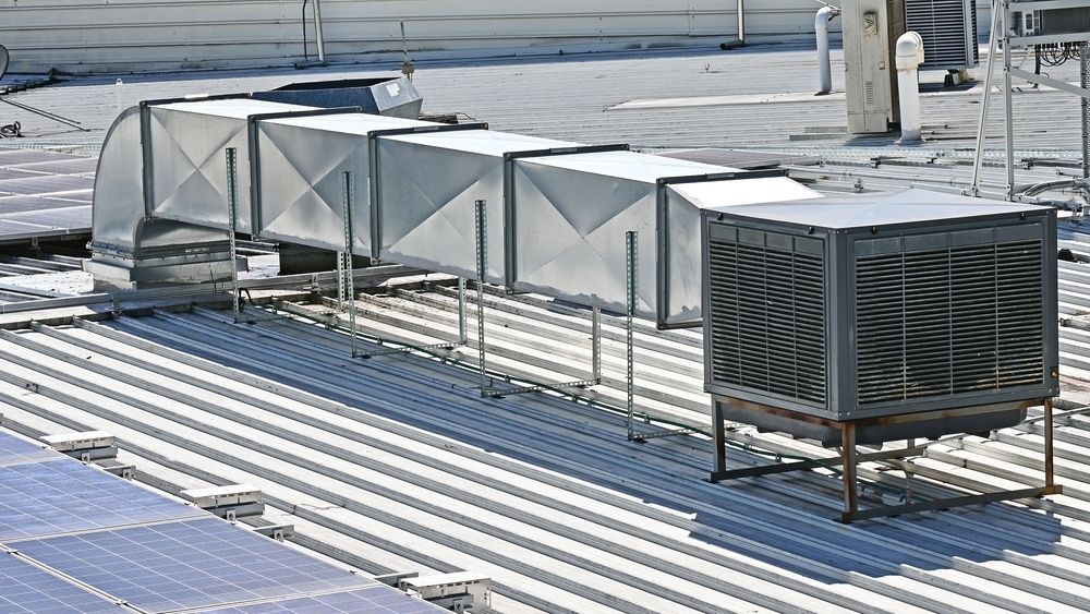 A Rooftop With A Lot Of Air Ducts On It — PalmAir Heating & Cooling Specialists In Wagga Wagga, NSW