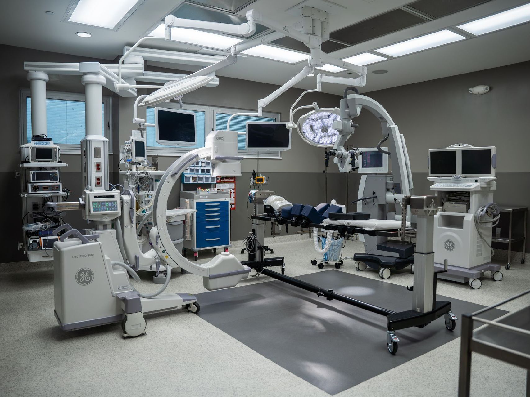 an operating room in a hospital with a lot of medical equipments