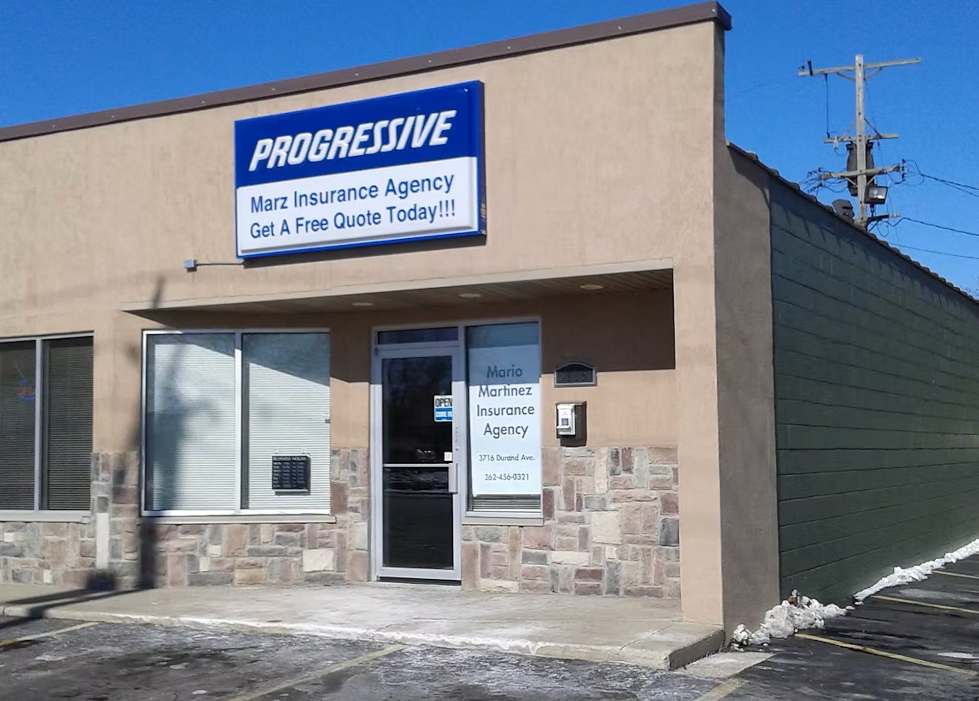 A building with a sign that says progressive on it