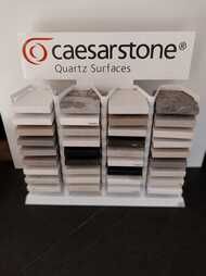 A display of different types of caesarstone quartz surfaces.