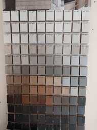 There are many different shades of gray paint on the wall.