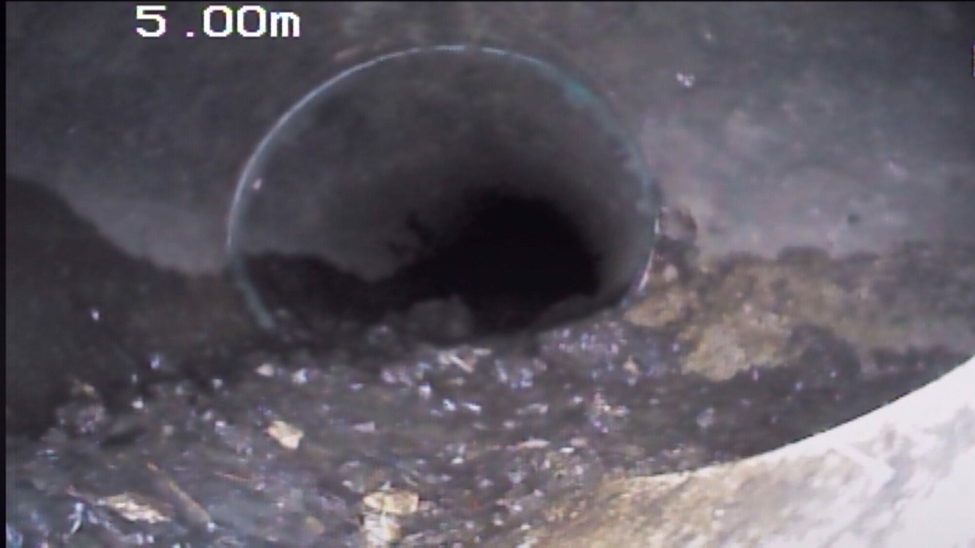 A video of a drain with a time stamp of 5.00m