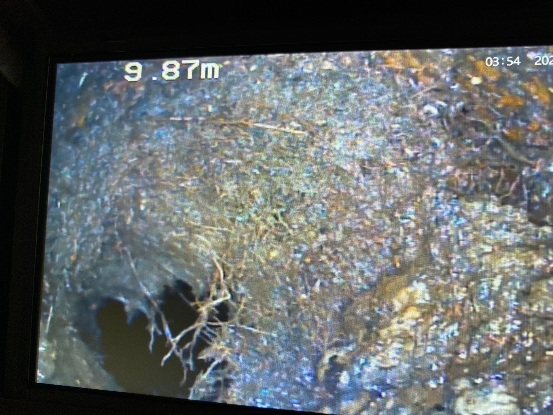 A close up of a drain on a television screen.