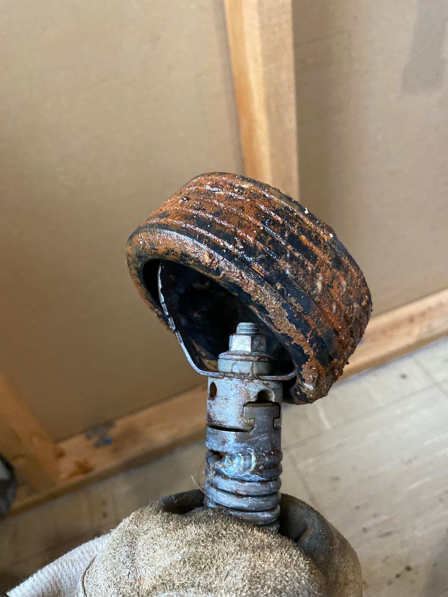A close up of a rusty object on a table.