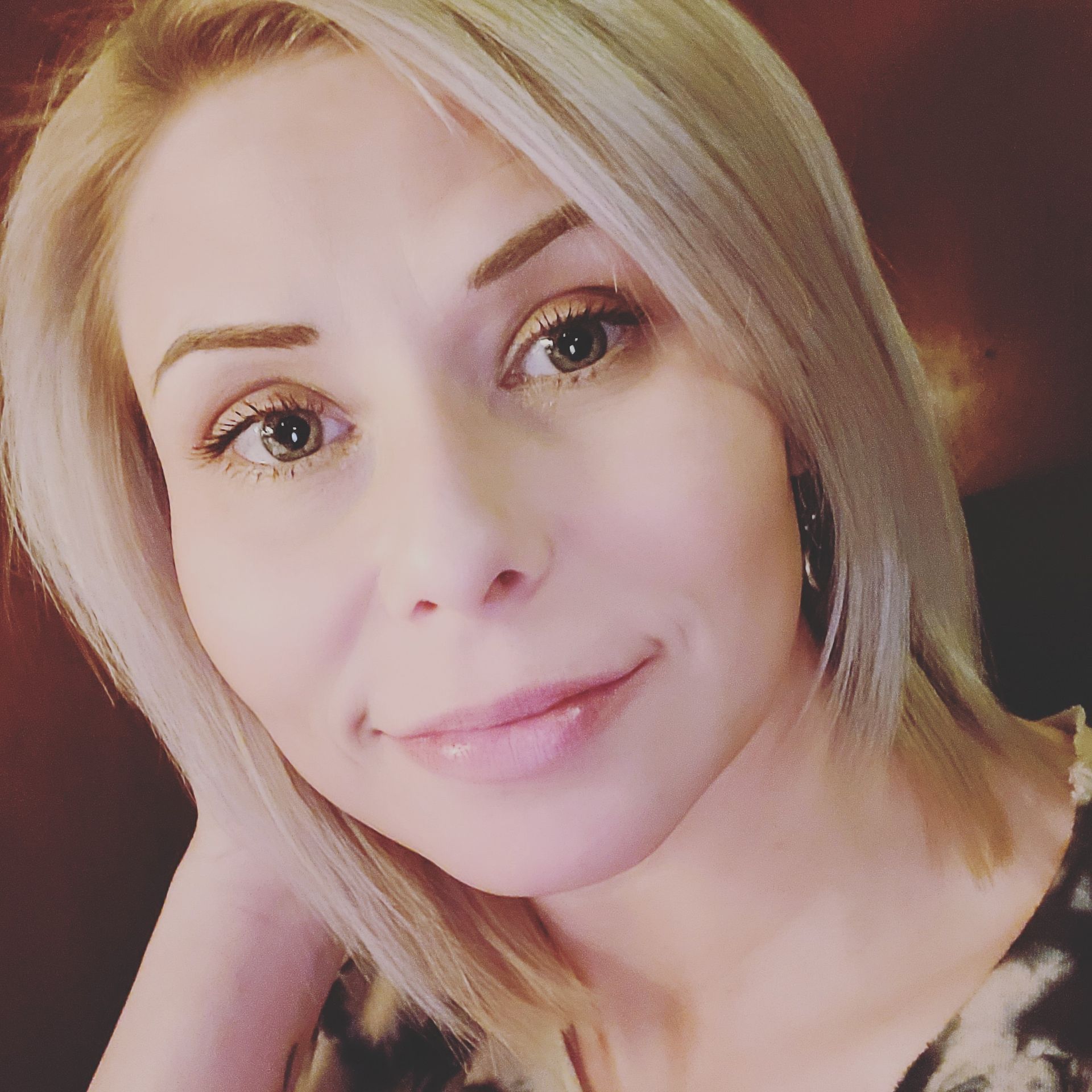 A close up of a woman 's face with blonde hair