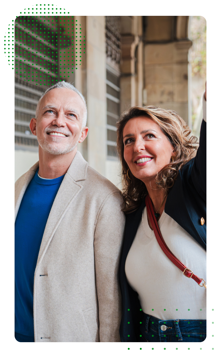 A man and a woman are standing next to each other and smiling.