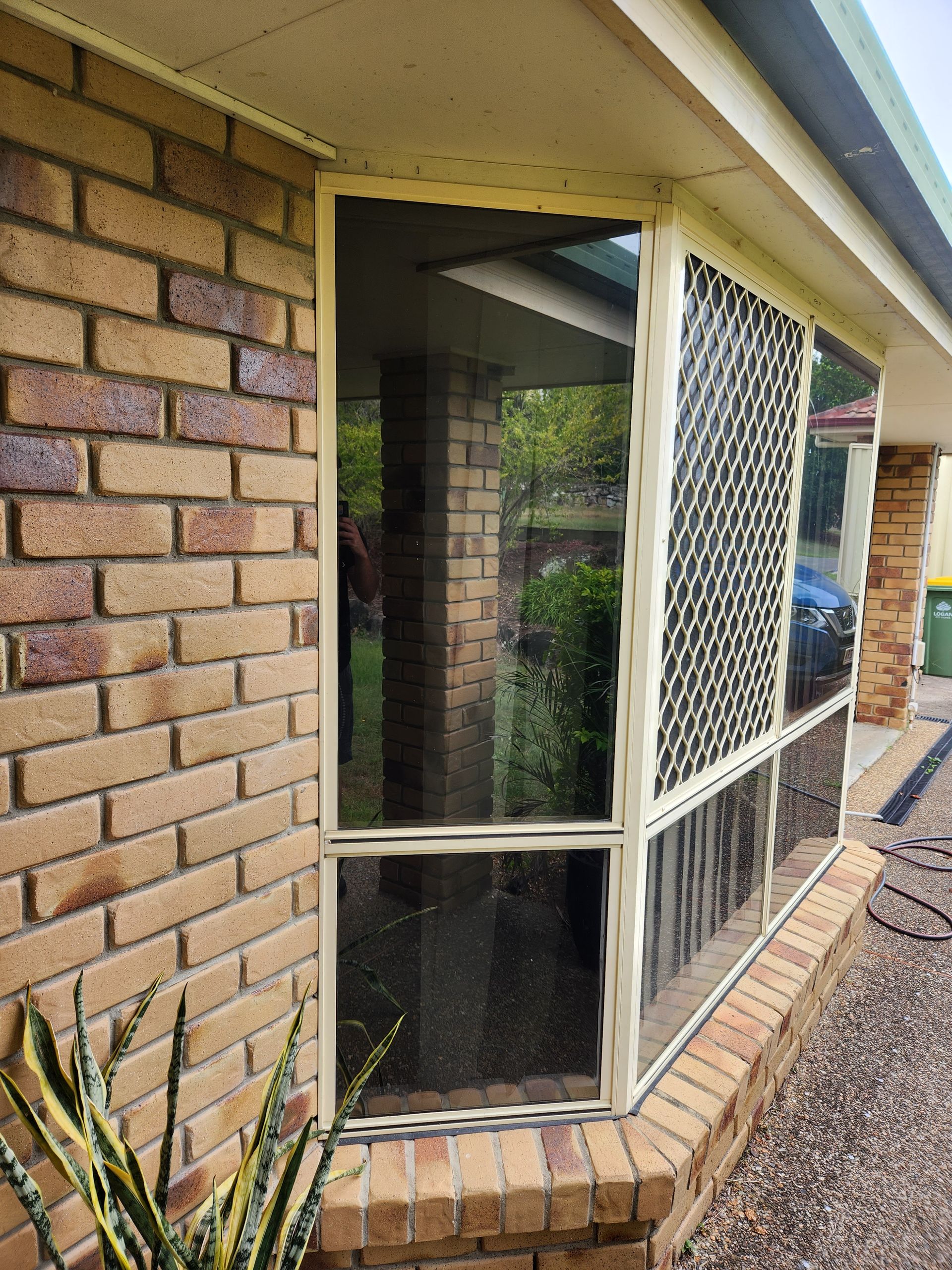 A bathtub in a bathroom next to a window
