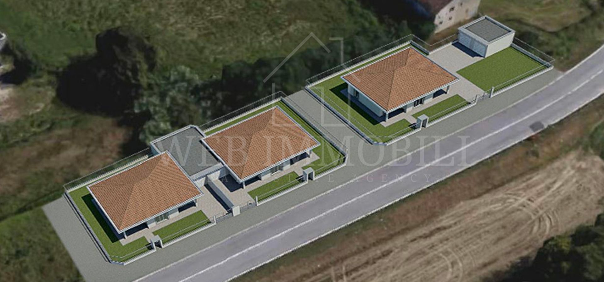 Vista aerea di tre case lungo una strada con prati verdi e tetti marroni.