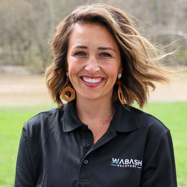 A woman wearing a black shirt with the word wabash on it