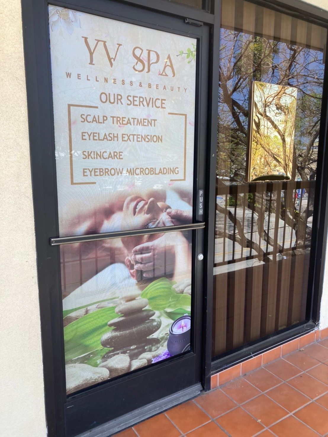 Spa entrance with services listed: scalp treatment, eyelash extension, skincare, eyebrow microblading.