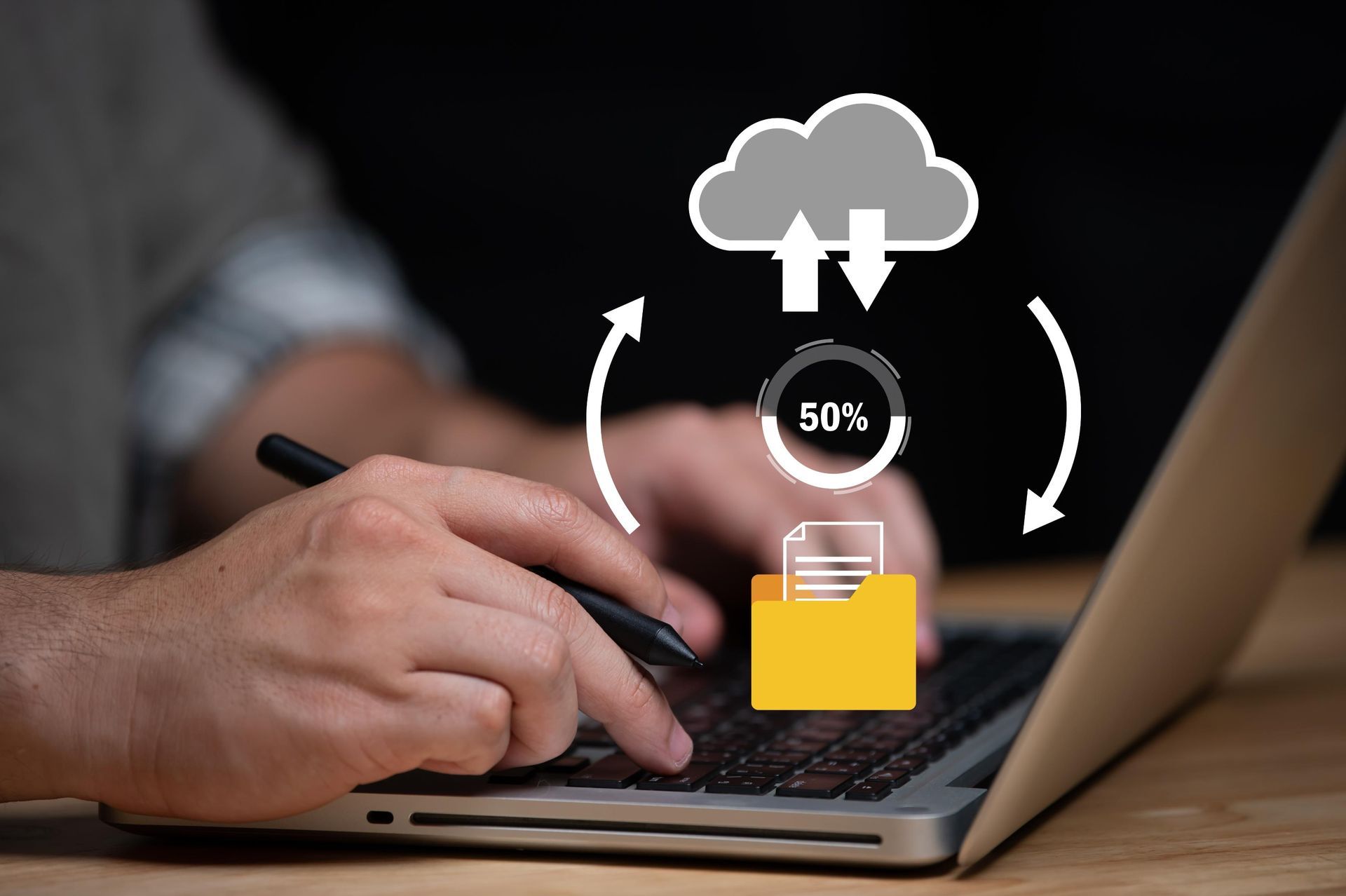 Person using laptop, uploading files to cloud storage; sync icon with 50% progress.