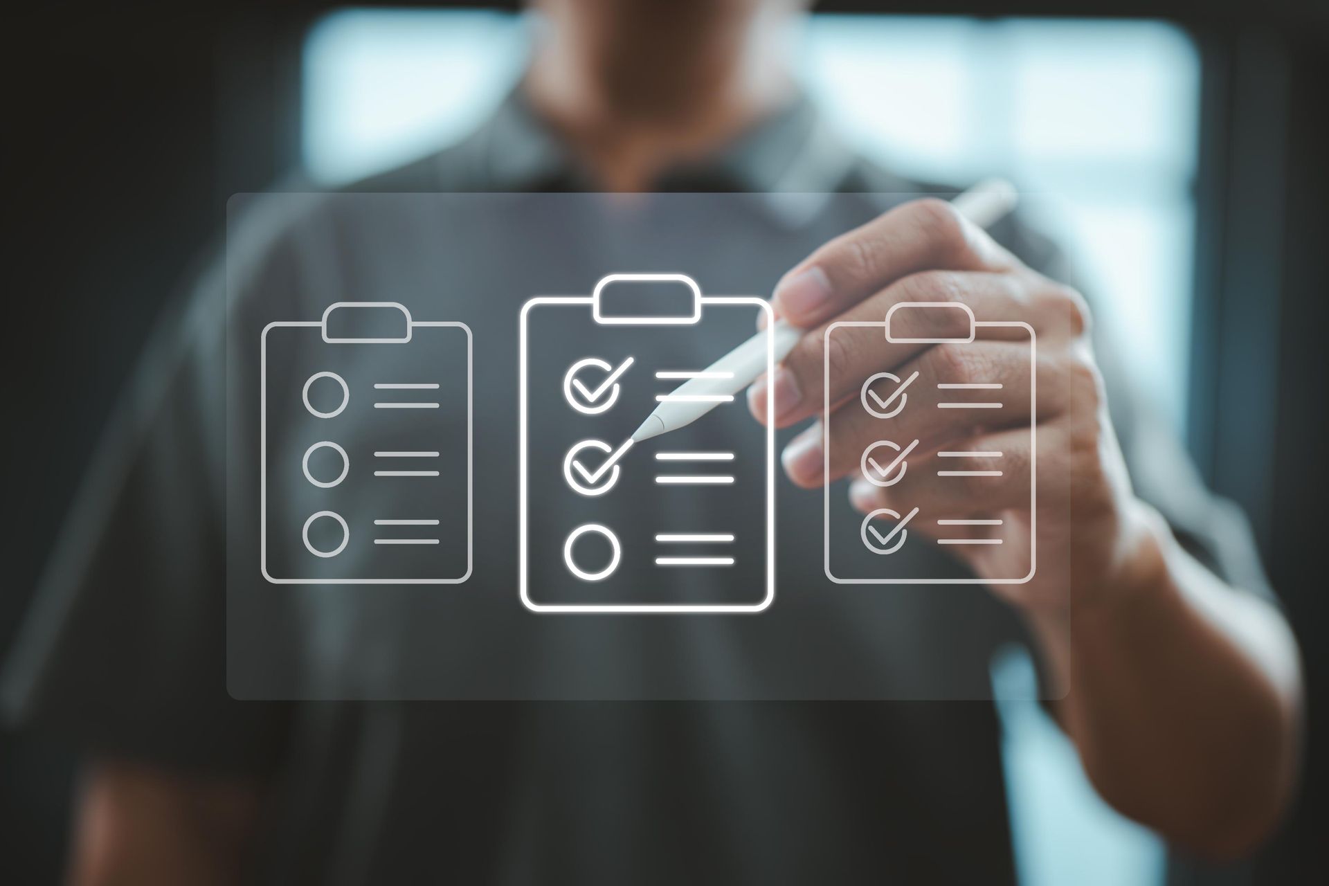 Man using a stylus to interact with an AR checklist on a screen, completing tasks.