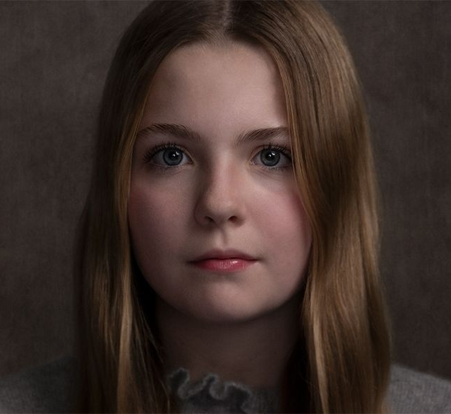 A classical photographic portraiture work, a close up of a young boy in incredible detail, part of a sibling trilogy.