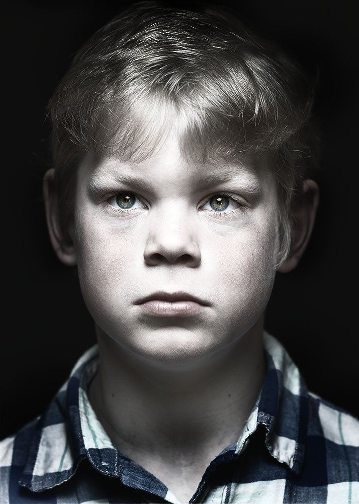 A classical photographic portraiture work, a close up of a child in incredible detail, with the eyes as a central focus.