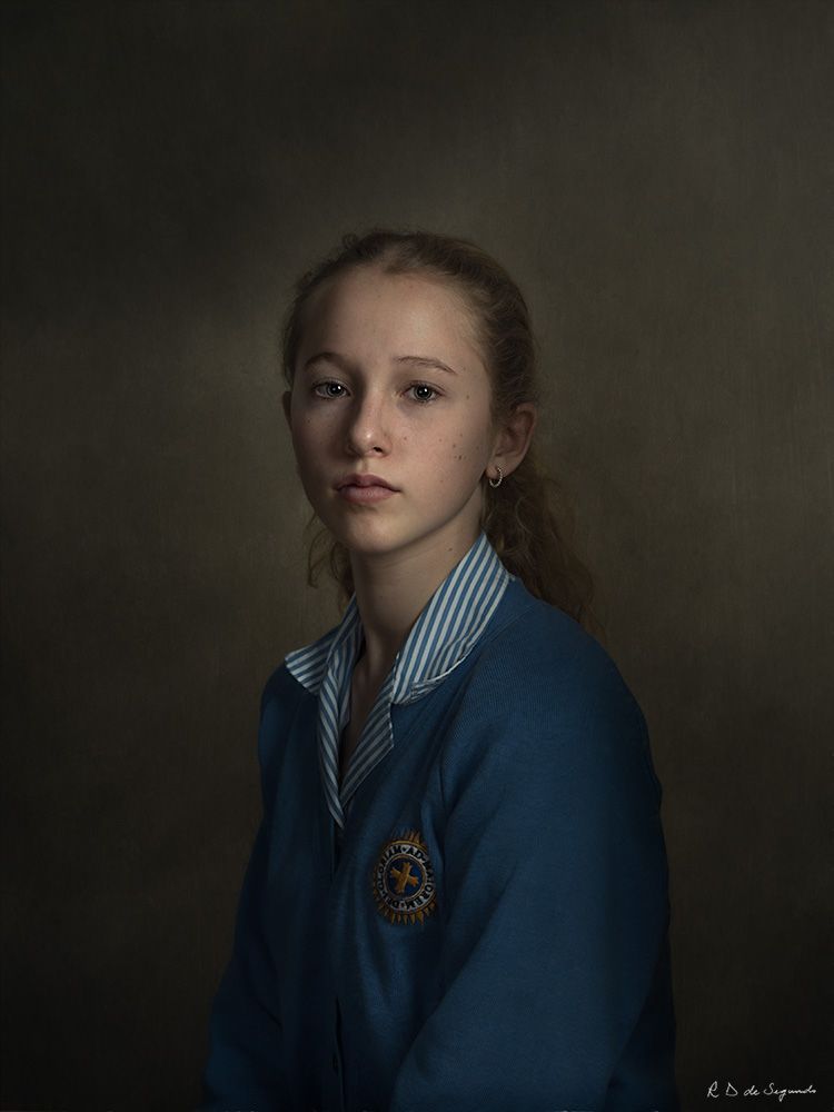 Studio fine art photo portrait of a young girl using intricate lighting to emulate a soft media portrait from the Golden Age.