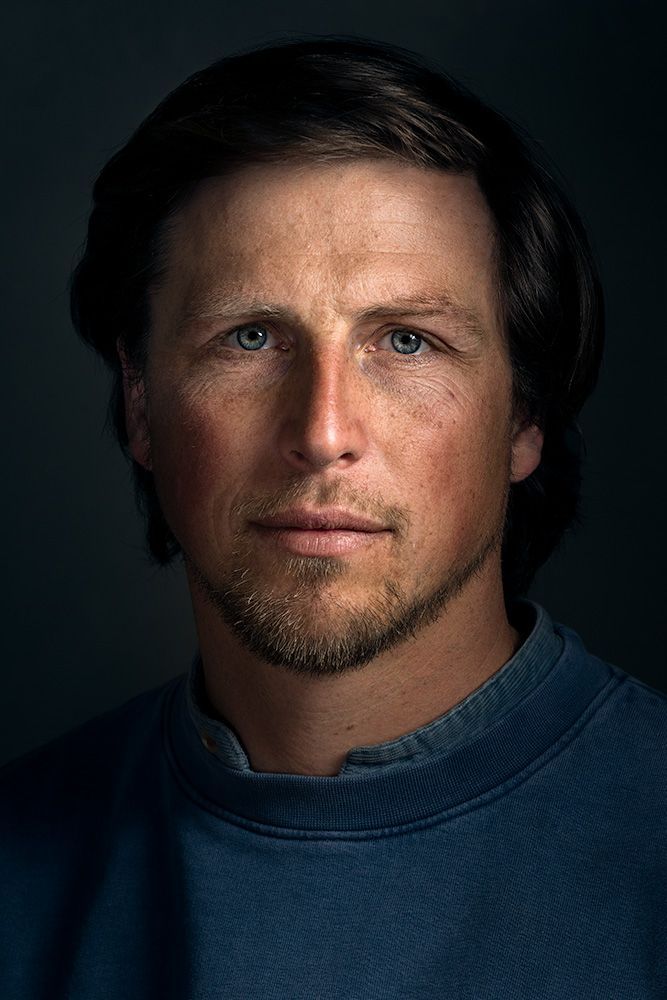 A classical photographic portraiture work, a close up of a man in incredible detail, with the eyes as a central focus.