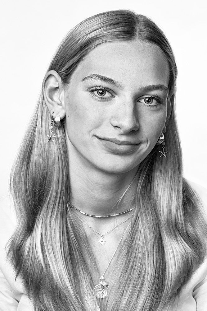 A classical photographic portraiture work, a close up of a teenage girl in incredible detail, shit in black and white.