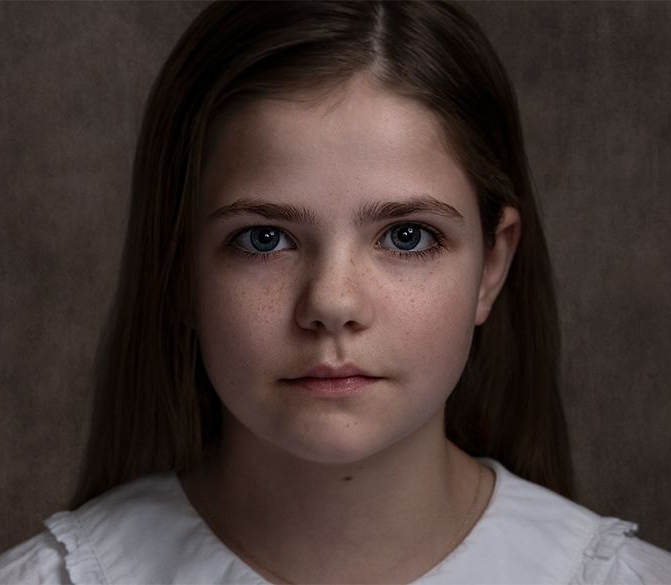 A classical photographic portraiture work, a close up of a young boy in incredible detail, part of a sibling trilogy.