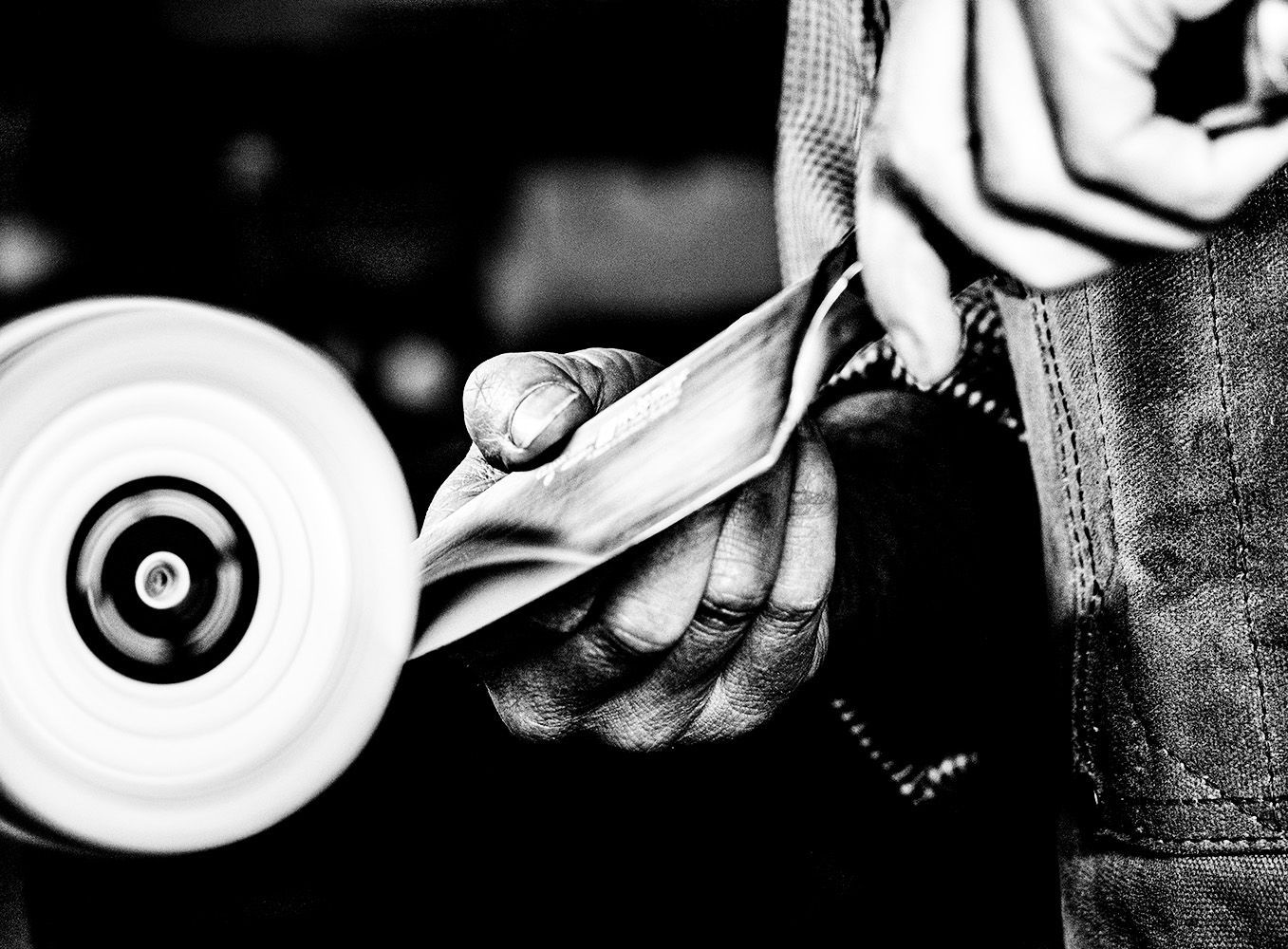 Black and white Knife maker fine art photo portrait capturing the creative process of hand knife making.