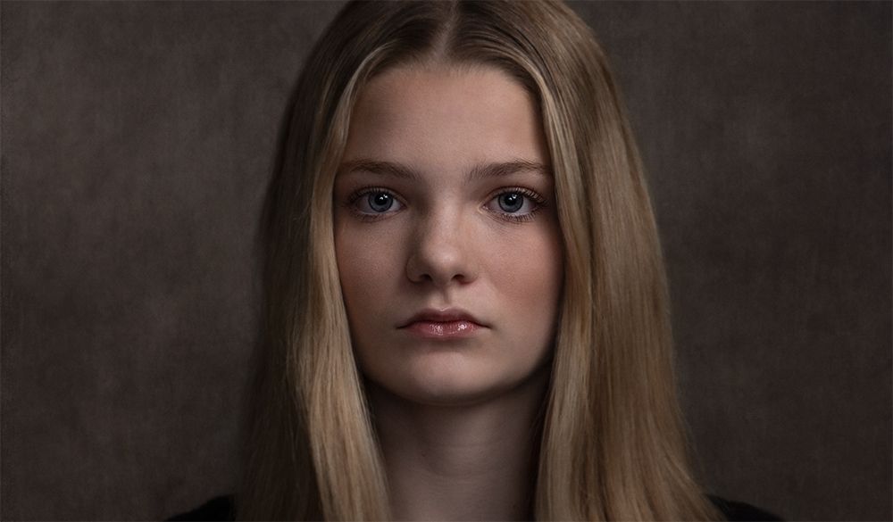 A classical photographic portraiture work, a close up of a young boy in incredible detail, part of a sibling trilogy.