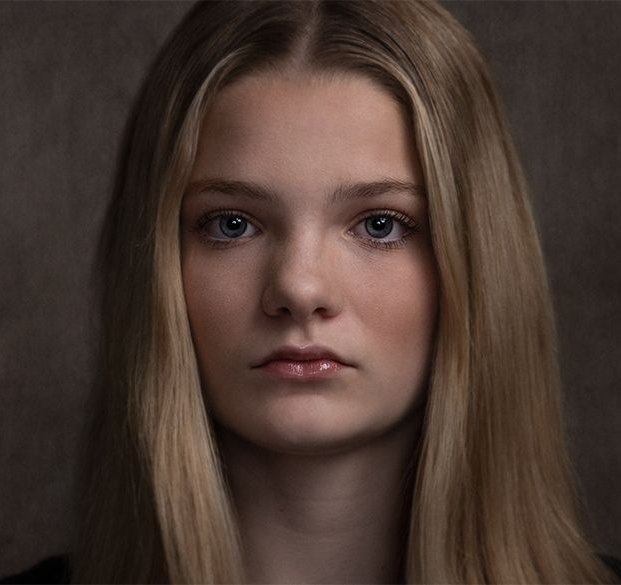 A classical photographic portraiture work, a close up of a young boy in incredible detail, part of a sibling trilogy.