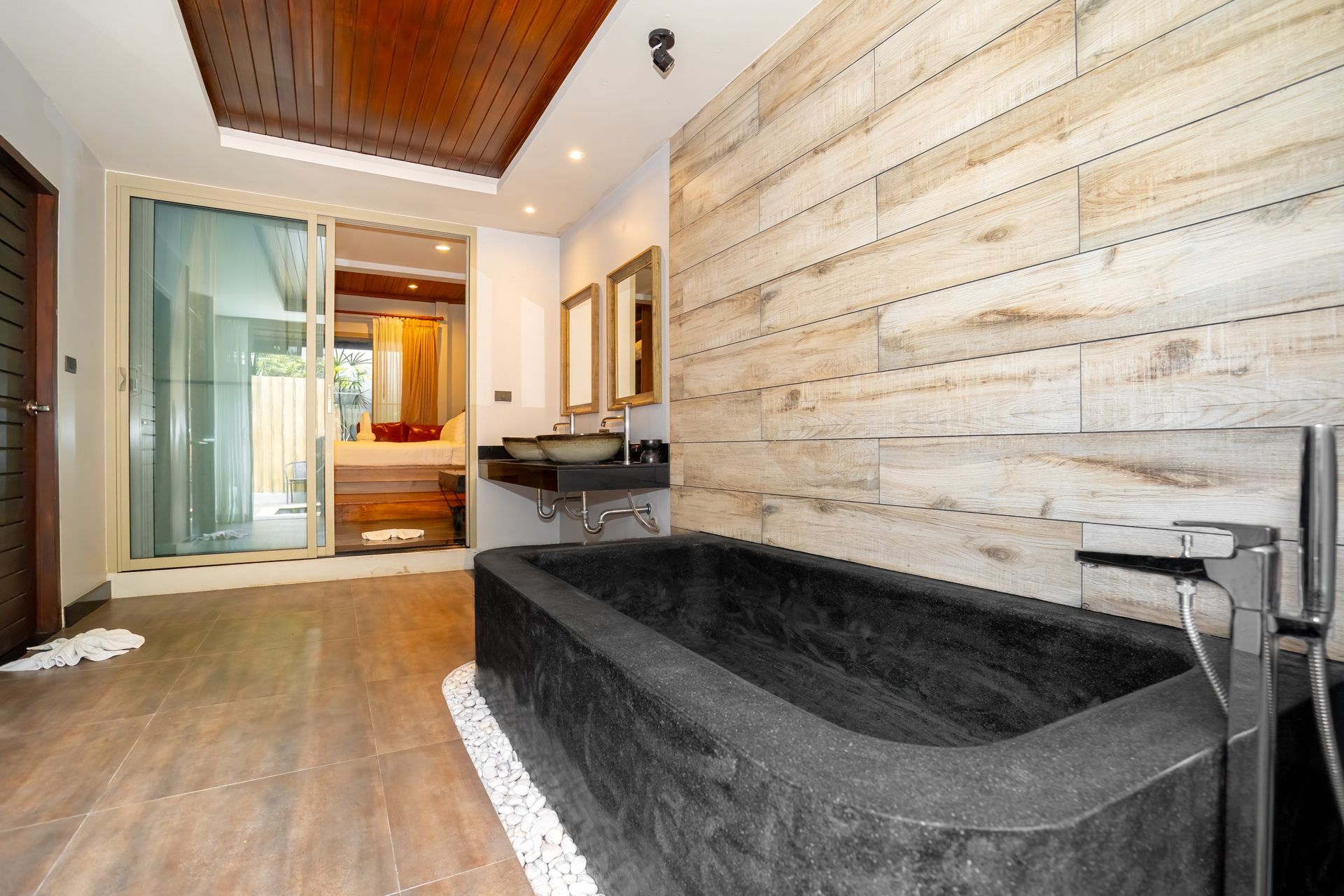 There is a large bathtub in the middle of the bathroom.