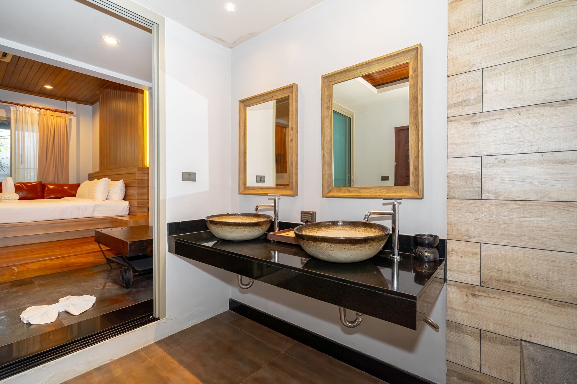 A bathroom with two sinks and two mirrors.